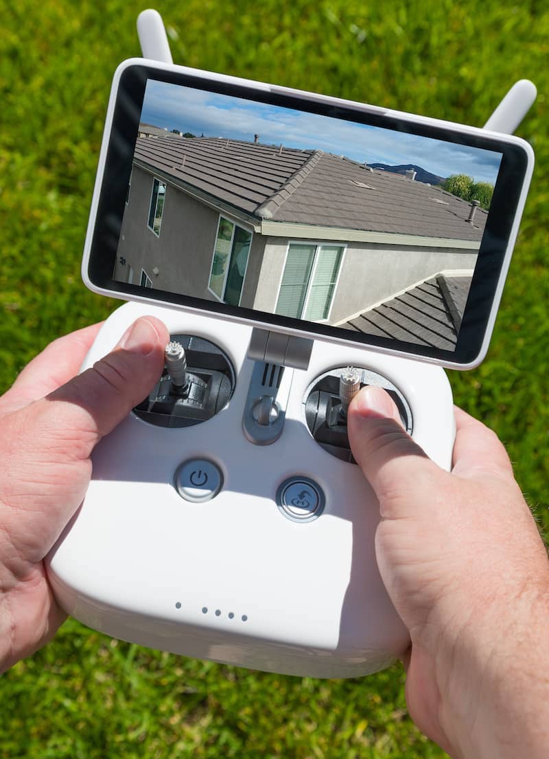 home inspector holding drone controller